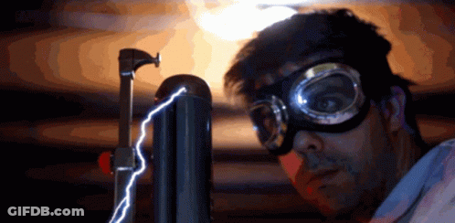 A Man Wearing Goggles And A Mask Looks At A Lightning Bolt GIF