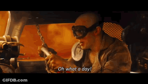 A Man Wearing Goggles Says " Oh What A Day " While Holding A Chain GIF