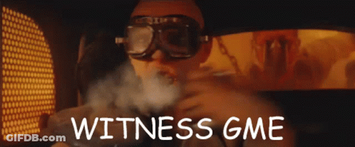 A Man Wearing Goggles With The Words Witness Gme Written On The Bottom GIF