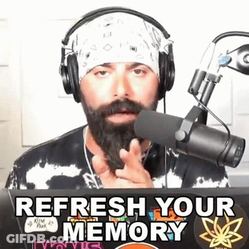 A Man Wearing Headphones And A Bandana Says " Refresh Your Memory " In Front Of A Microphone GIF