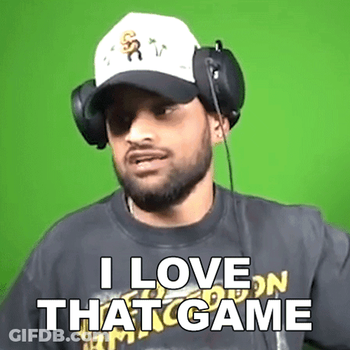 A Man Wearing Headphones And A Baseball Cap Says I Love That Game GIF