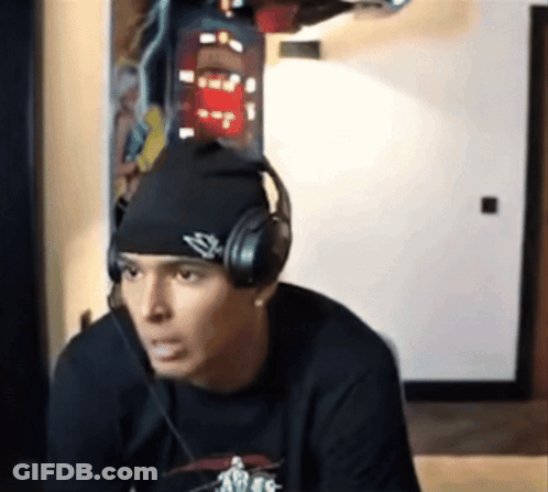 A Man Wearing Headphones And A Beanie Has The Letter S On It GIF