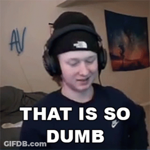 A Man Wearing Headphones And A Beanie Is Making A Funny Face . GIF