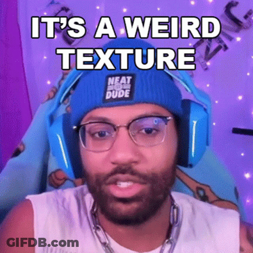 A Man Wearing Headphones And A Beanie Is Making A Funny Face While Talking On A Video Call . GIF