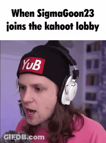A Man Wearing Headphones And A Beanie With A Yub Patch On It . GIF