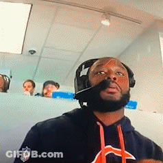 A Man Wearing Headphones And A Bears Shirt GIF
