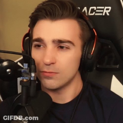 A Man Wearing Headphones And A Black Acer Chair GIF