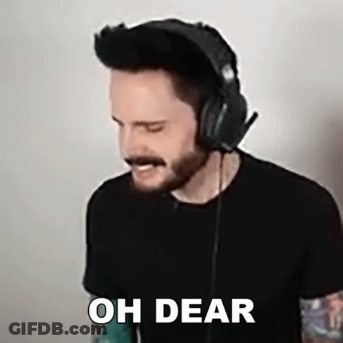 A Man Wearing Headphones And A Black Shirt Says Oh Dear . GIF