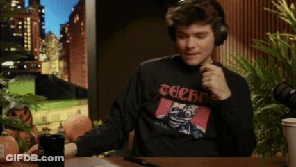 A Man Wearing Headphones And A Black Shirt That Says Techno GIF