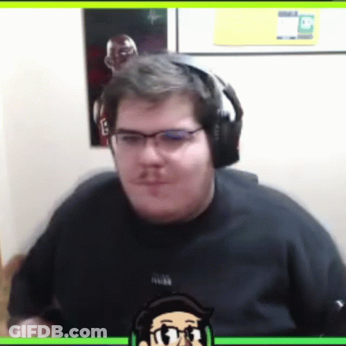 A Man Wearing Headphones And A Black Shirt With A Picture Of A Man On It GIF