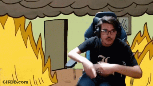 A Man Wearing Headphones And A Black Shirt With The Number 70 On It Is Sitting In Front Of A Fire GIF