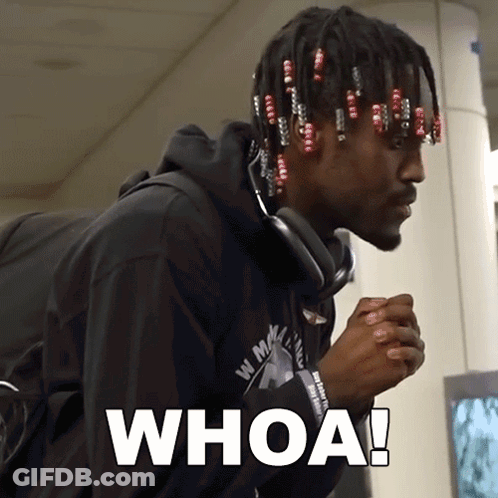 A Man Wearing Headphones And A Black Shirt With The Word Whoa On It GIF