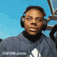 A Man Wearing Headphones And A Blue Adidas Hoodie Looks At The Camera GIF