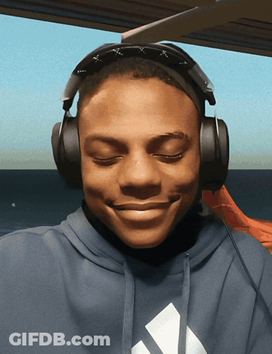 A Man Wearing Headphones And A Blue Adidas Hoodie GIF