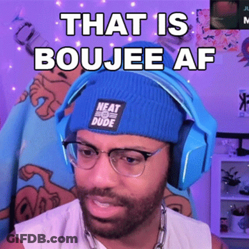 A Man Wearing Headphones And A Blue Beanie That Says Neat Dude GIF