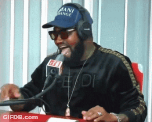 A Man Wearing Headphones And A Blue Hat That Says Mani Gang GIF