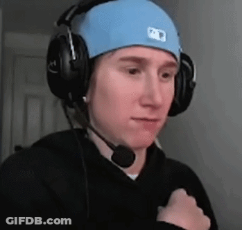 A Man Wearing Headphones And A Blue Hat With A Microphone On His Head . GIF
