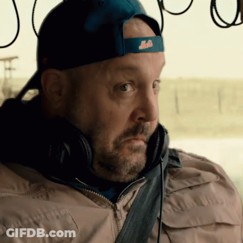 A Man Wearing Headphones And A Blue Hat With The Word Mets On It GIF