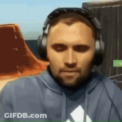 A Man Wearing Headphones And A Blue Hoodie With An Adidas Logo GIF