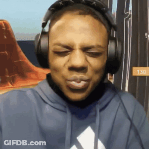 A Man Wearing Headphones And A Blue Hoodie With The Number 130 On It GIF