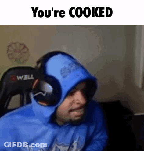 A Man Wearing Headphones And A Blue Hoodie With The Words `` You 'Re Cooked '' Written On It . GIF