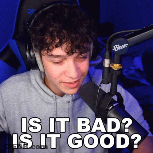 A Man Wearing Headphones And A Blue Microphone Says " Is It Bad " GIF