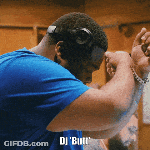 A Man Wearing Headphones And A Blue Shirt Says " Dj Butt " On The Bottom GIF