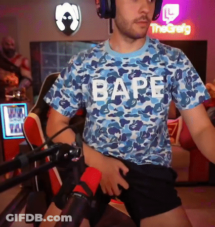 A Man Wearing Headphones And A Blue Shirt That Says Bape GIF