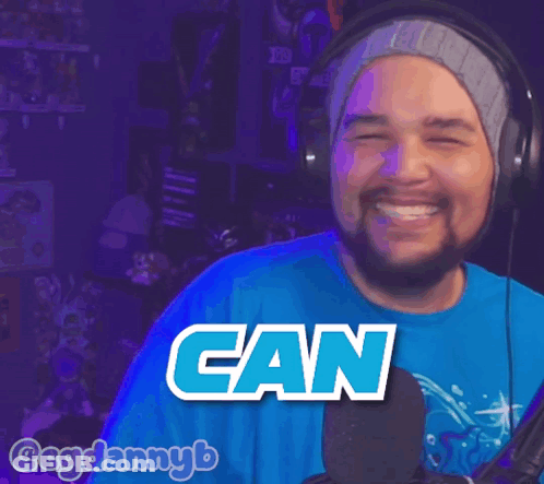 A Man Wearing Headphones And A Blue Shirt That Says Getta On It GIF
