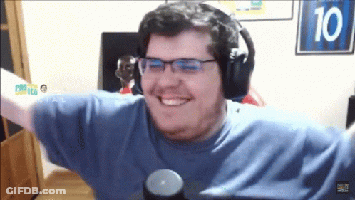 A Man Wearing Headphones And A Blue Shirt With The Number 10 Behind Him GIF