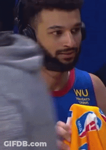 A Man Wearing Headphones And A Blue Shirt With Wu Western Union On It GIF