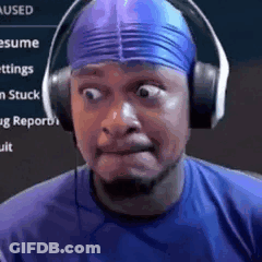 A Man Wearing Headphones And A Blue Swim Cap Is Making A Face . GIF
