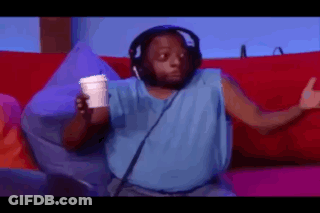 A Man Wearing Headphones And A Blue Tank Top Is Sitting On A Couch Holding A Cup Of Coffee . GIF