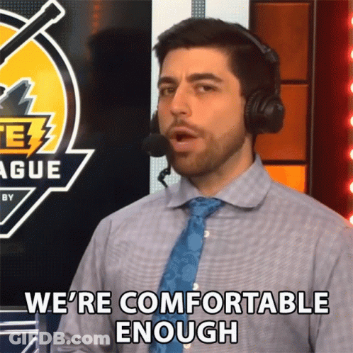 A Man Wearing Headphones And A Blue Tie Says We 'Re Comfortable Enough GIF