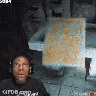 A Man Wearing Headphones And A Call Of Duty Shirt Looks Surprised GIF