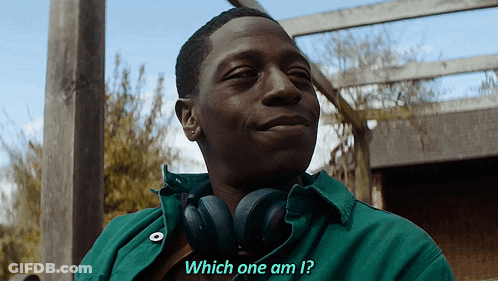 A Man Wearing Headphones And A Green Shirt Is Asking Which One Am I GIF