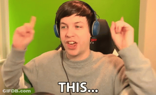 A Man Wearing Headphones And A Grey Sweater Says " This " GIF