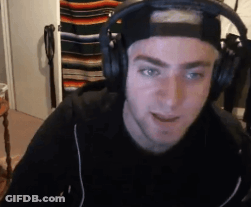 Man With Headphones And Hat Looking At Camera GIF