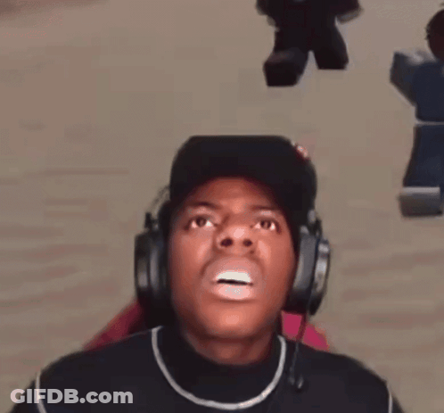 A Man Wearing Headphones And A Hat Is Making A Face . GIF