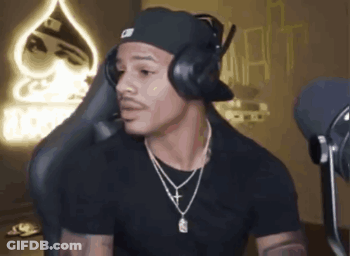 Man With Headphones And Hat In Front Of Microphone GIF