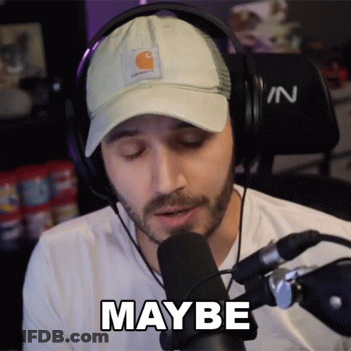 A Man Wearing Headphones And A Hat Says " Maybe " In Front Of A Microphone GIF