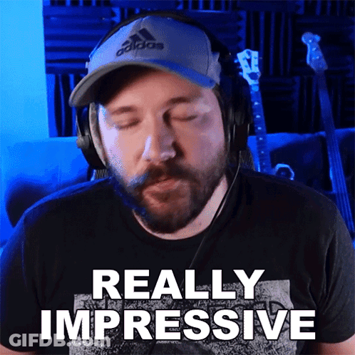 A Man Wearing Headphones And A Hat Says " Really Impressive " GIF