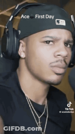 A Man Wearing Headphones And A Hat That Says Ace First Day On It GIF