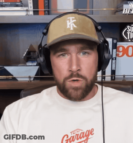 A Man Wearing Headphones And A Hat That Says Tk GIF