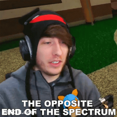 A Man Wearing Headphones And A Hat With The Words The Opposite End Of The Spectrum Below Him GIF