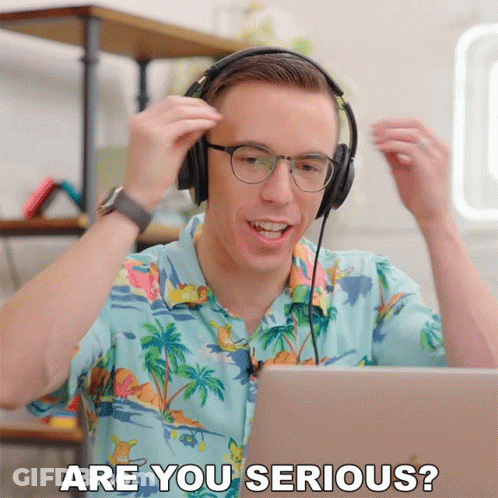 A Man Wearing Headphones And A Hawaiian Shirt Is Asking Are You Serious GIF