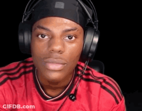 A Man Wearing Headphones And A Headband Is Making A Face . GIF