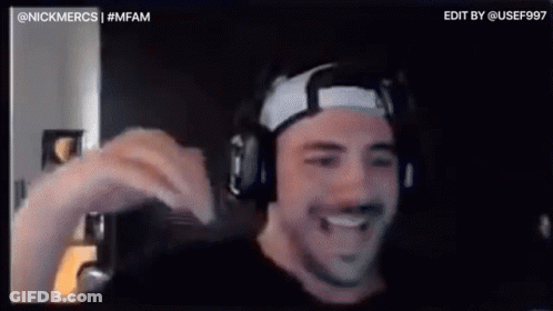 A Man Wearing Headphones And A Headband Is Smiling In A Video Chat . GIF