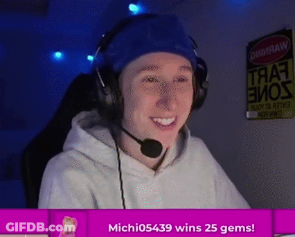 A Man Wearing Headphones And A Headband Is Smiling With The Words Michi05439 Wins 25 Gems Below Him GIF