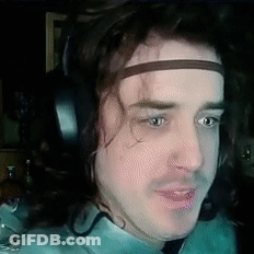 A Man Wearing Headphones And A Headband With The Letter S On It GIF